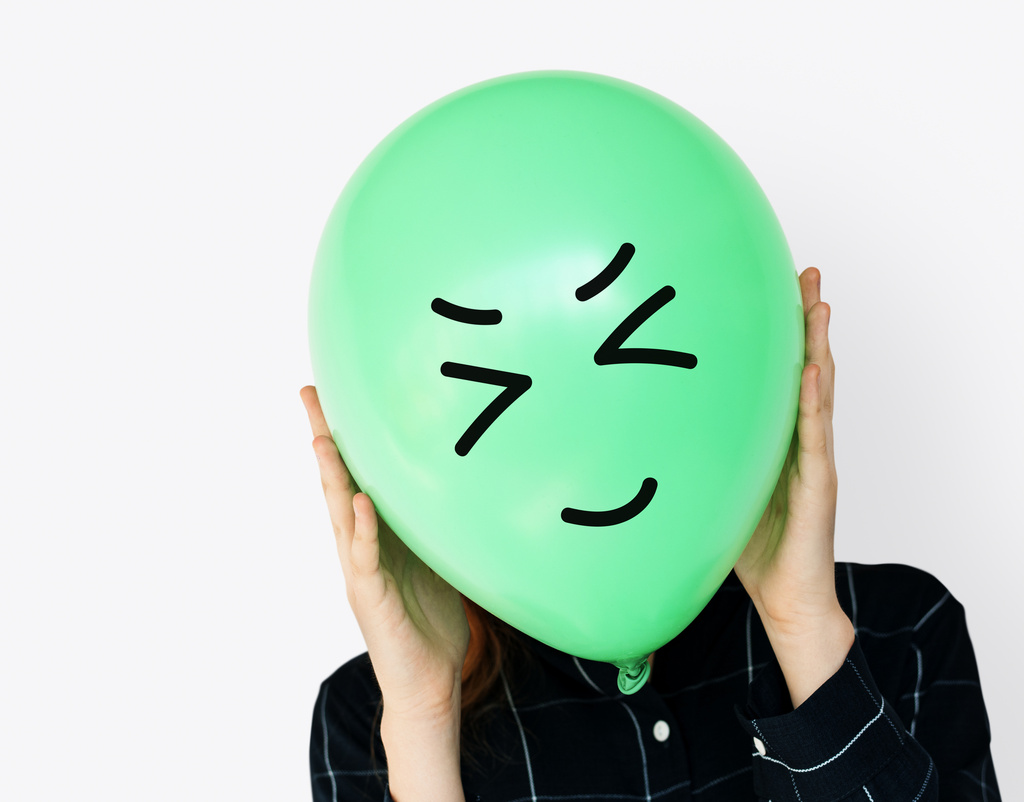 people-faces-covered-with-happy-expression-emotion-balloons.jpg